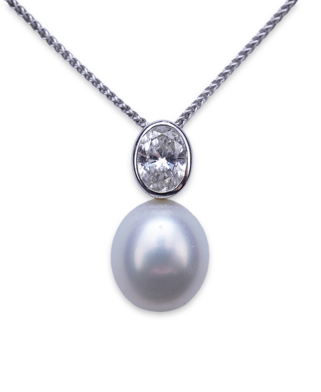 A cultured pearl and diamond pendant